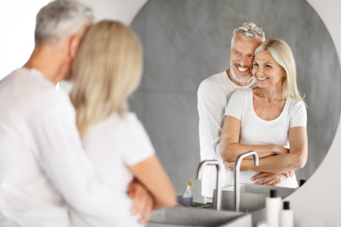 Happy senior couple enjoying their mobility-friendly shower space in Portsmouth, designed for ease and independence.